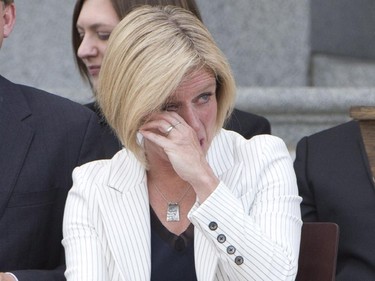 Rachel Notley sheds a tear as her late father is mentioned during her swearing in as Alberta's 17th premier in Edmonton on Sunday, May 24, 2015.