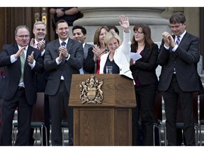 Rachel Notley is applauded after being sworn in as Alberta's 17th premier in Edmonton on Sunday, May 24, 2015.