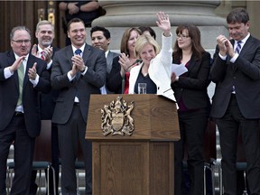 Rachel Notley is applauded after being sworn in as Alberta's 17th premier in Edmonton on Sunday. Reader says the NDP government should be treated with more respect.