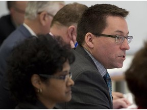 Rene Gallant, president of the Nova Scotia Barristers' Society, along with executive committee members, listens to presentations regarding Trinity Western University's proposed law school in Halifax on Feb. 12, 2014. Over two dozen individuals were slated to appear at the hearing.