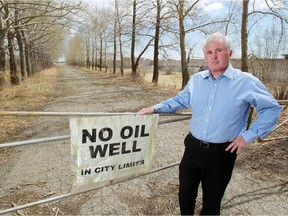 Calgary Coun. Ward Sutherland, former president of the Rocky Ridge Royal Oak Community Association, stands in a field behind the Royal Oak shopping centre where an oil well had been proposed. Two years ago, many area residents weren't happy with a plan to drill oil wells on the site.