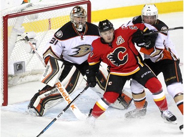 Calgary Flames centre Jiri Hudler battled against Anaheim Ducks defenceman Cam Fowler outside the net of Frederik Andersen during second period NHL playoff action at the Scotiabank Saddledome on May 8, 2015.