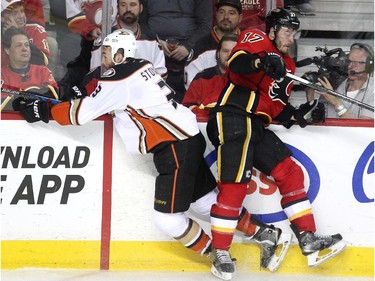 Calgary Flames centre Lance Bouma ran Anaheim Ducks defenceman Clayton Stoner into the boards during second period NHL playoff action at the Scotiabank Saddledome on May 8, 2015.