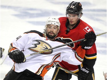 Calgary Flames centre Sean Monahan and Anaheim Ducks centre Nate Thompson battled during second period NHL playoff action at the Scotiabank Saddledome on May 8, 2015.