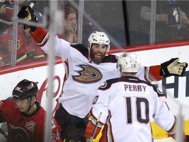 Anaheim Ducks left winger Patrick Maroon, left, celebrated with teammate right winger Corey Perry after scoring an empty net goal against the Calgary Flames during third period NHL playoff action at the Scotiabank Saddledome on May 8, 2015. The Ducks won the game 4-2 and took a three games to one lead over the Flames in the series.