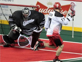 Calgary's Curtis Dickson, beats Edmonton Rush goalie Aaron Bold in their NLL west final playoff game last year. The two rivals will go head to head again after the Roughnecks upset the Colorado Mammoth in Round 1 on Saturday.