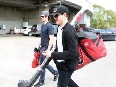 Calgary Flames players centre Sean Monahan, left, and centre Lance Bouma walked out after speaking with coaches during the annual garbage bag day at the Scotiabank Saddledome on May 12, 2015.