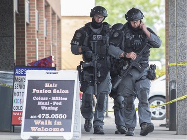 The Calgary Police TAC Teamexits Willow Park Centre after a man was shot to death inside Wednesday May 27.