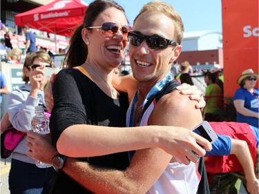 Justin Kurek gets a kiss from his wife Audrey after finishing first in the 50K race.