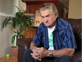 Dave Loeppky in his northeast Calgary home in Calgary, Alberta Tuesday, October 1, 2013. He was allegedly attacked by a police dog last week, after he made a reference to a gun during a 911 call.