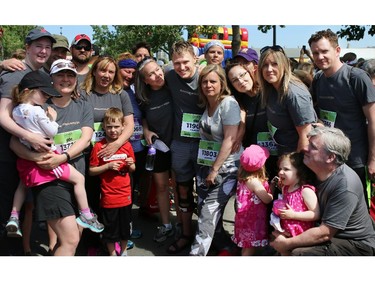 Friends and family of Herald reporter Tamara Gignac, who died of cancer on Friday came out on Sunday to walk/run in her honour at the 5K portion of the Scotiabank Calgary Marathon. Her Husband, Heath McCoy, is in the centre, number 1190.