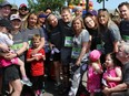 Friends and family of Herald reporter Tamara Gignac, who died of cancer on Friday, came out on Sunday to walk/run in her honour at the 5 km portion of the Scotiabank Marathon. Her Husband Heath McCoy is in the centre.