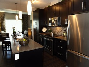 The kitchen in the Esprit II townhome in Ebony, a development in Mahogany by Jayman Modus.