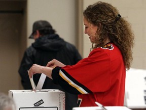 Many Calgarians were geared for the Calgary Flames game, as well as voting, like Stefani Walstra who voted in riding Calgary-Klein at Thorncliffe-Greenview Community Centre, in Calgary on May 5, 2015.