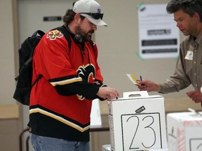 Many Calgarians were geared up for the Calgary Flames game, as well as voting, like Sean Bowden, who voted in Calgary-Klein at Thorncliffe-Greenview Community Centre, in Calgary on May 5, 2015.