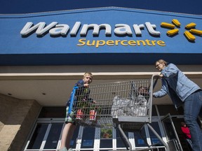 Ryan Hehr, 5, shops with his mom Karrie at a Walmart Supercentre in Calgary, on May 21, 2015.