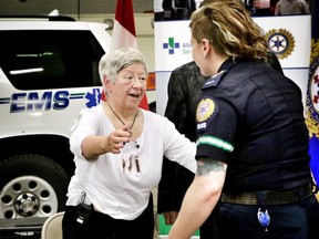 CALGARY.;  MAY 27, 2015  -- Marilyn Stallworthy greets Paramedic Brynna Jesse, right, who helped save her life almost two years ago in Calgary. Photo Leah Hennel, Calgary Herald  (For City story by ?)