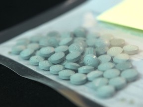A bag of seized fentanyl on display at a Calgary Police Service news conference on March 25, 2015.