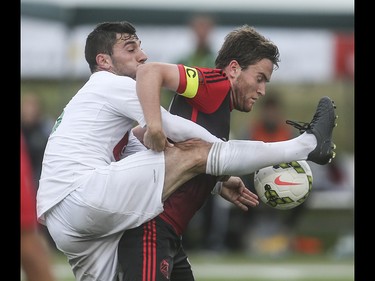 Foothills FC striker Yoann Promonet, left,  kicks his way to keeping the Portland Timbers at a standstill at Hellard Field in Calgary on Tuesday, June 2, 2015. The Foothills FC tied the Portland Timbers, 1-1, at the end of regular season Premier Development League play.