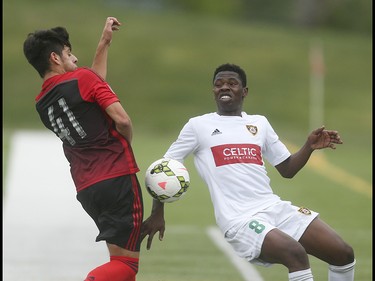 Foothills FC midfielder Elijah Adekugbe, right, fights with Portland Timbers striker Adrien Perez for control of the ball in a contentious first half at Hellard Field in Calgary on Tuesday, June 2, 2015. The Foothills FC led the Portland Timbers, 1-0, at the first half of regular season Premier Development League play.