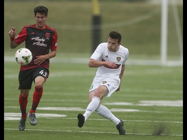 Foothills FC striker Yoann Promone, right, kicks down field at Hellard Field in Calgary on Tuesday, June 2, 2015. The Foothills FC led the Portland Timbers, 1-0, at the first half of regular season Premier Development League play.