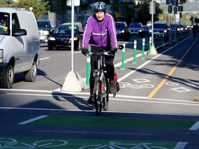 Bill Cozens uses the new cycle tracks on his morning commute to work in Calgary on June 4.