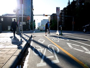 Commuters use the cycle track  along 12 Avenue in Calgary on June 4.