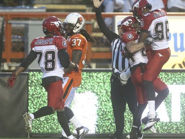 The Calgary Stampeders celebrate a touchdown over the B.C. Lions at McMahon Stadium in Calgary on Friday, June 12, 2015. The Calgary Stampeders won over the B.C. Lions, 20-6, at the end of the the first pre-season exhibition game for the team.