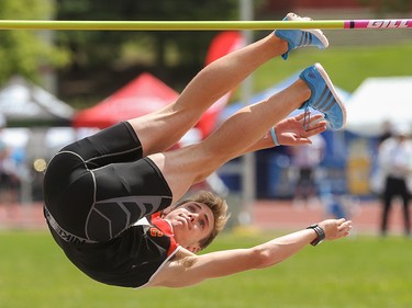 Austin Ost clears the high jump bar in the Caltaf Track Classic in Calgary on Saturday, June 20, 2015.