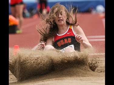 Molly Brown lands her long jump at the Caltaf Track Classic in Calgary on Saturday, June 20, 2015.