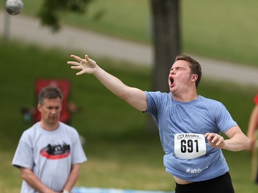 Jakob Brinkhof sends his 5kg shot put flying in the Caltaf Track Classic in Calgary on Saturday, June 20, 2015.