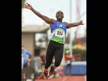 Gee-ef Nkwonta sails through the air white competing in the long jump in the Caltaf Track Classic in Calgary on Saturday, June 20, 2015.