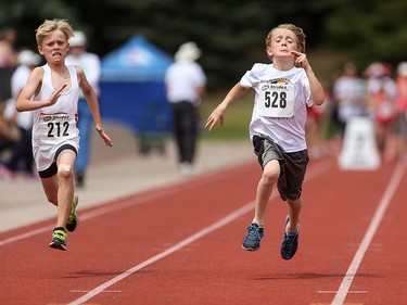 Nicholas Emerson, left, and Markus Boland race in the boys 60 metre pee wee dash at the Caltaf Track Classic in Calgary on Saturday, June 20, 2015.