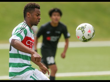 Foothills FC player Natnael Nat Tecle left, prepares to stop a long kick across the field at Hellard Field in Calgary on Sunday, June 21, 2015.