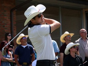 Olympian luge athlete Sam Edney tries out his swing at the Shaw Charity Classic as it gets into the Stampede spirit by hosting its annual Shootout at the Meadows at the Canyon Meadows Golf Club on June 24.