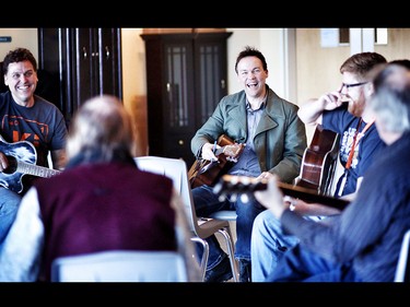 Local singer-songwriter Kris Demeanor, middle, is participating in the Calgary Drop-in and Rehab Centre's Shelter From the Storm program, a six-month-long songwriting initiative that pairs him with music-oriented clients, staff and volunteers at Canada's largest homeless shelter. Every Saturday since January, the participants have met on the sixth floor of the DI to share stories and ideas, and work collectively on songs that reflect the culture of the shelter.