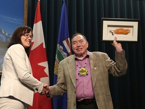 Minister of Aboriginal Relations Kathleen Ganley, left, and Chief Vincent Yellow Old Woman of Siksika Nation during an announcement at McDougall Centre on Friday. The Siksika chief made comments following the announcement on the NDP government's recent apology on residential schools.