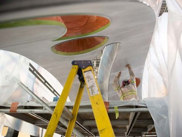 In order to meet its deadline, Reggin Industries had a crew of 10 men working on the piece over the final week of fabrication; Sei had to catch an early morning ride to Vancouver on Saturday, June 6. The work, comprised of one piece of curved stainless steel, will sit on a plinth of black granite and marble.