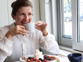 Andrea Brassart, operating partner at Suzette Bistro, enjoys a coffee with her Crepes Gariguette.