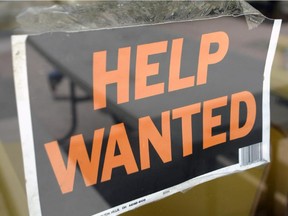 A help wanted sign hangs on the window of Gino's Pizza in Miami Beach, Florida, Friday, August 5, 2005. U.S. employers added 207,000 workers in July, a bigger increase than forecast, and wages grew at the fastest pace in a year, suggesting companies are gaining confidence as the economy picks up speed. Photographer: Mike Fuentes/Bloomberg News *CALGARY HERALD MERLIN ARCHIVE*