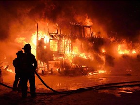 Fire is shown engulfing a seniors residence in L'Isle-Verte, Que., early Thursday, Jan. 23, 2014.