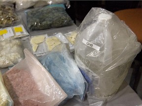 A variety of drugs, including the date rape drug GHB are on display during a news conference  in this file photo from December 6, 2010.