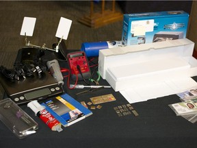 After a six month investigation into credit card fraud scheme, Calgary Police seized this equipment to manufacture fake credit cards. June 18, 2015.