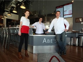 The owner of Abe's, Bernie Levert, poses with Jaymi Bradley and Alicia Santaguida in his Airdrie restaurant, on June 16, 2015.