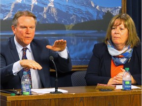 Alberta Energy Minister Marg McCuaig-Boyd, right, and Dave Mowat, the president and CEO of ATB Financial, take questions in the legislature media room after McCuaig-Boyd announced Mowat will head up a review of Alberta's oil and gas royalty structure on Friday, June 26, 2015.