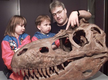 In 1999 Scott Mair, Head of Education with the Royal Tyrrell Museum in Drumheller, Alberta tells four year old Britannia Reitsma and her two year old brother Robert of North Vancouver about the Albertasaurus, an early and smaller relative of Tyrannosaurus Rex, who roamed North America.