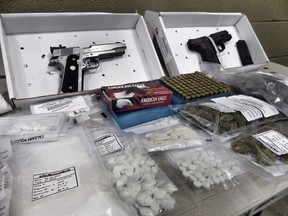 ALERT officers executed search warrants at a downtown Calgary apartment and Erin Woods home on June 18, 2015, and seized two handguns, $30,000 worth of cocaine and pills, ammunition, marijuana, and $7,595 in suspected proceeds of crime.