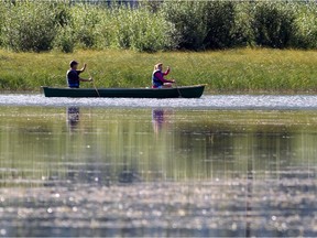 Visitors enjoy canoeing on Vermilion Lakes in Banff National Park last summer.