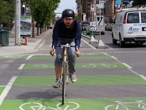 Colin Chubachi with the City of Calgary checks out the 12th Avenue cycle track in the Beltline on June 1, 2015, a day before it opens to the public.