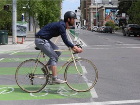 Colin Chubachi with the City of Calgary checks out the 12th avenue cycle track. Reader says skateboarders should try their luck at getting designated lanes, too.